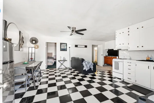 a living room with furniture and a rug