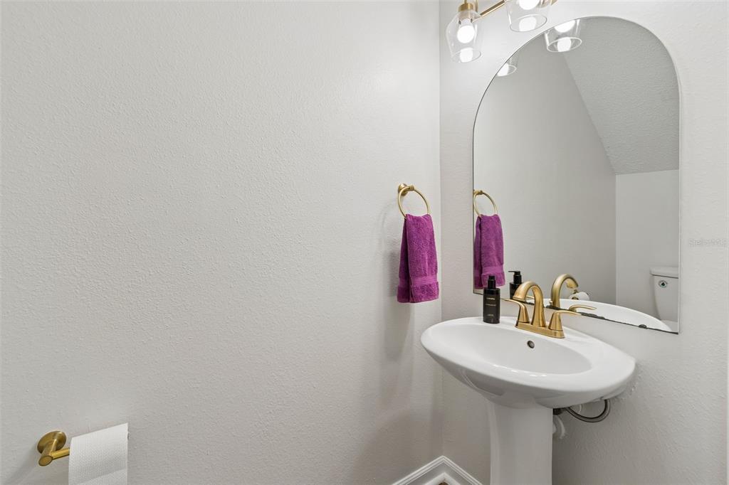 382 Countryside Key Boulevard Oldsmar, FL 34677 - Photo 24 of 58 a bathroom with a sink and a mirror