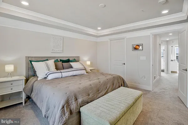 a bedroom with a bed and a walk in closet