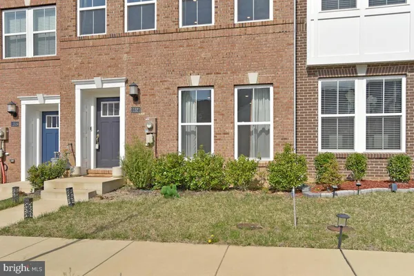 a view of a brick house with outdoor space