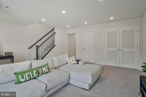 a spacious bedroom with a bed and a couch