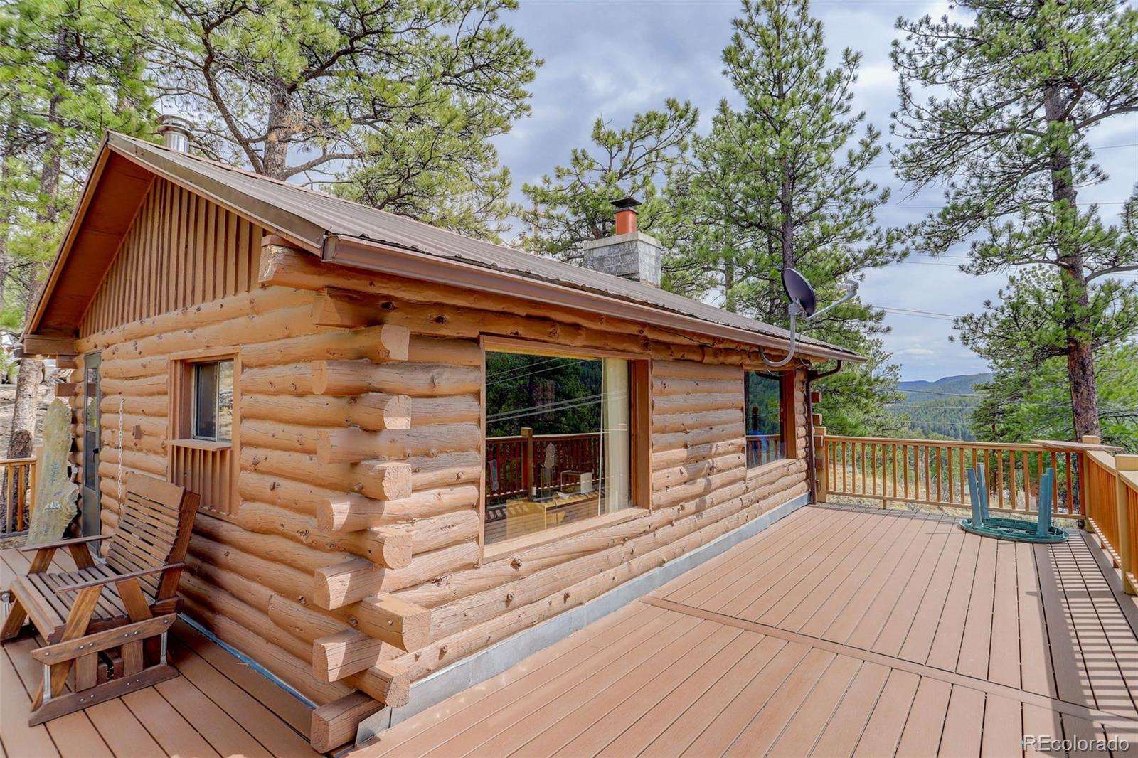 Undisclosed Address Bailey, CO 80421 - Photo 19 of 21 a backyard of a house with wooden floor