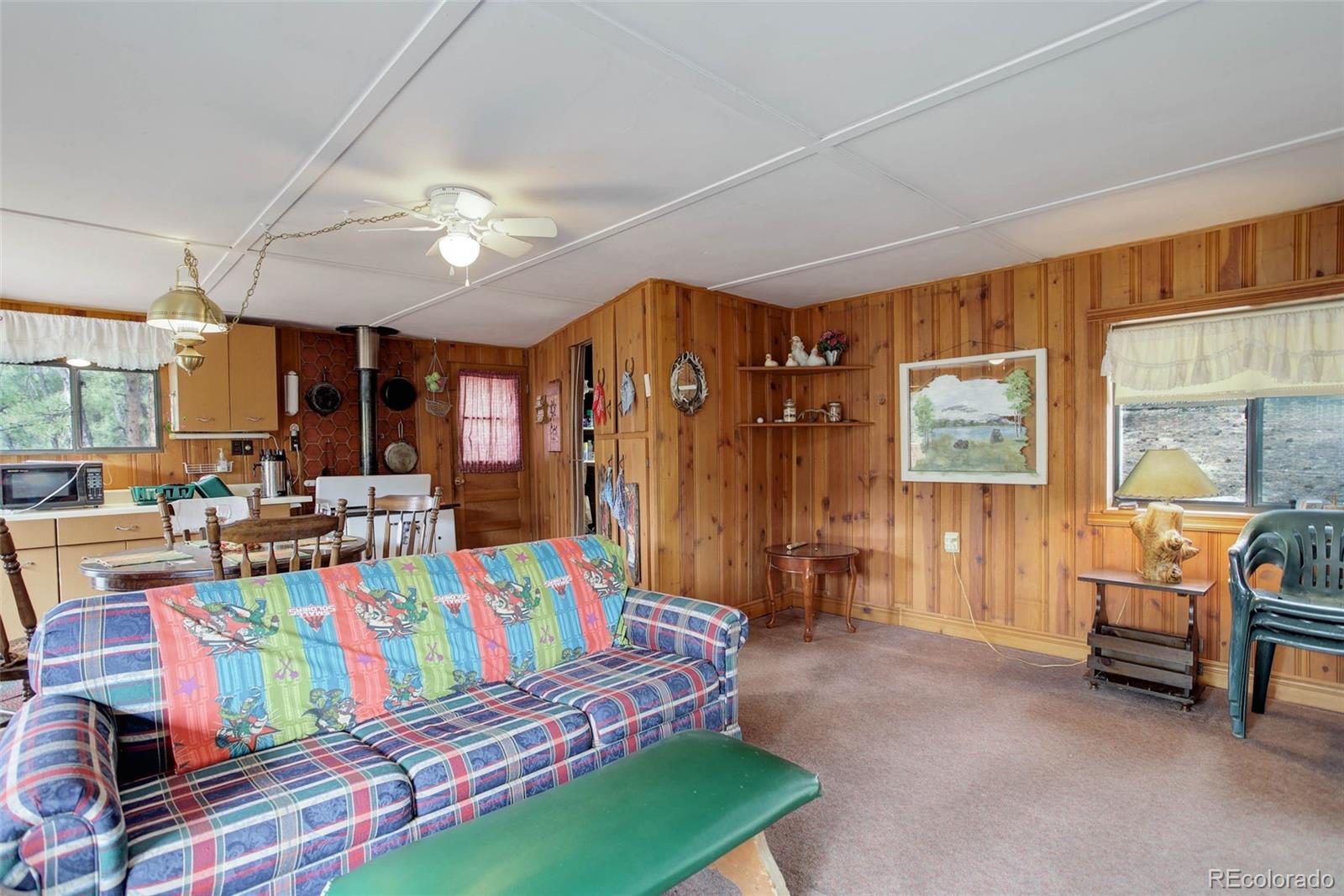 Undisclosed Address Bailey, CO 80421 - Photo 5 of 21 a bedroom with furniture and a large window