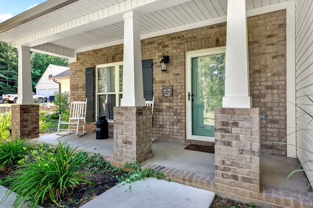 247 Mabel Hill Road Toney, AL 35773 - Photo 3 of 29 a porch with seating space