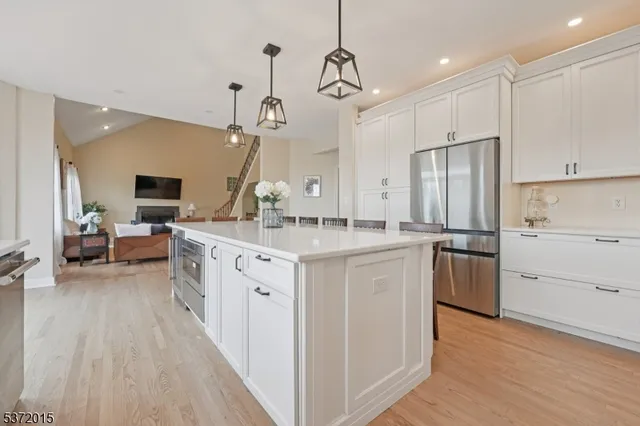 a kitchen with a sink stove and refrigerator