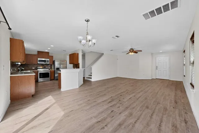a view of a kitchen with microwave and cabinets