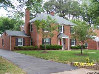 4808 Morrison Road Richmond, VA 23230 - Photo 1 of 8 a front view of a house with a yard and trees
