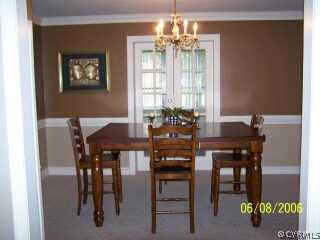4808 Morrison Road Richmond, VA 23230 - Photo 6 of 8 a view of a dining room with furniture and chandelier