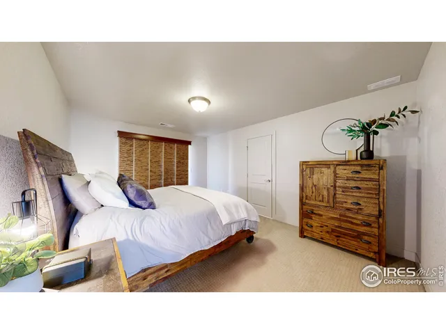 a bedroom with a bed and with furniture