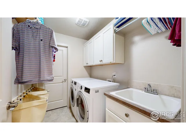 a bathroom with a sink double vanity and a tub