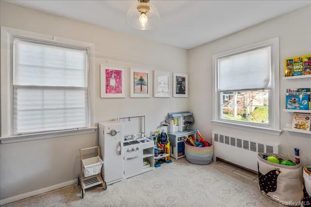 a bedroom with bed and a window