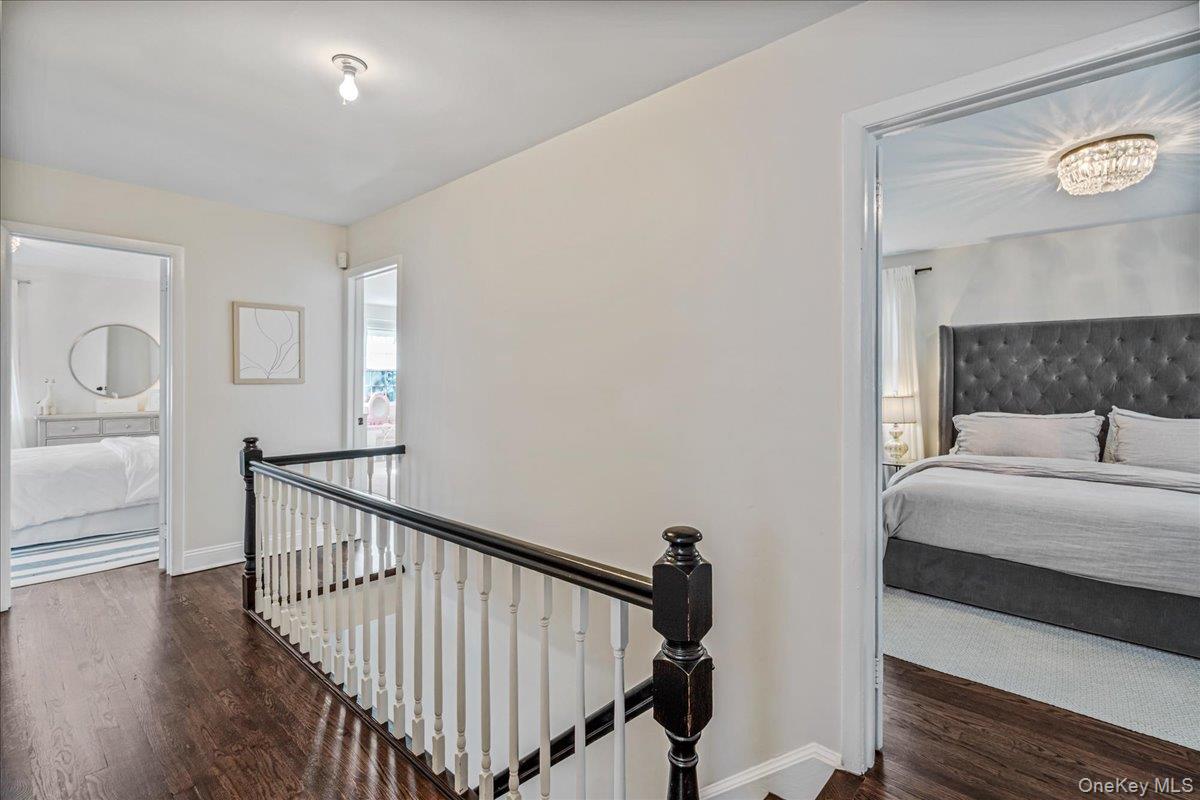 53 Stuart Place Manhasset, NY 11030 - Photo 17 of 32 a bedroom with bed and a window