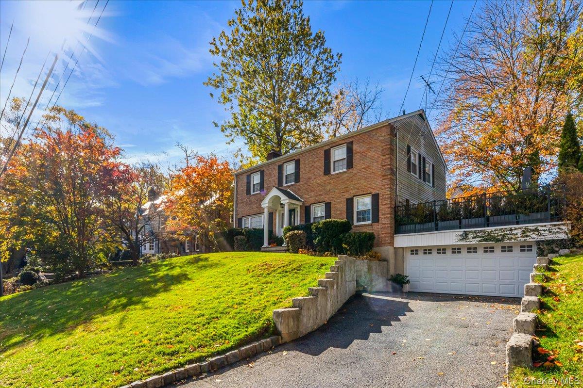 53 Stuart Place Manhasset, NY 11030 - Photo 4 of 32 a view of a house with a yard