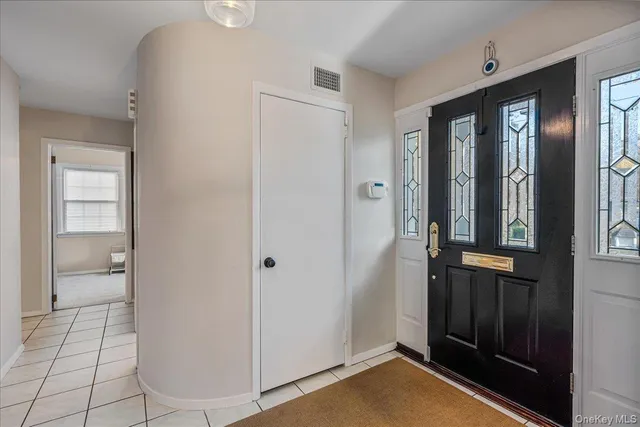 a view of staircase with lots of frames and couches