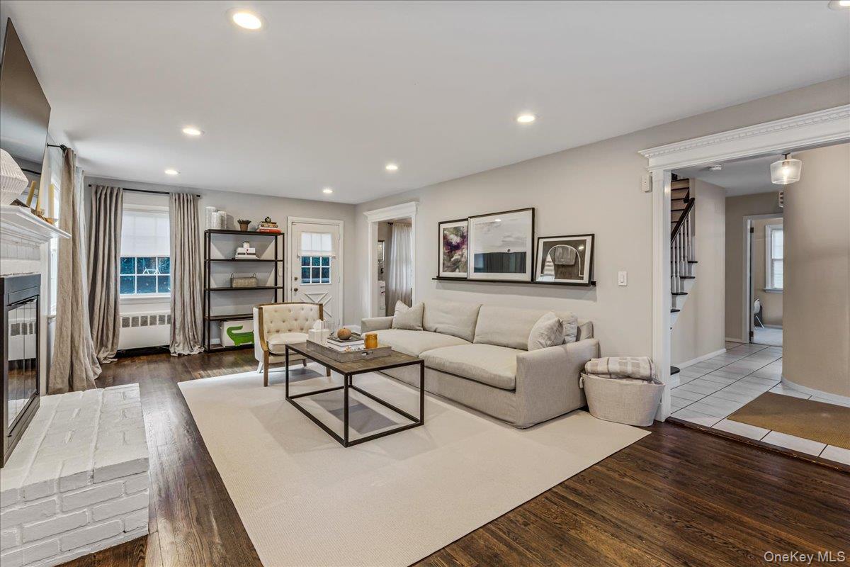 53 Stuart Place Manhasset, NY 11030 - Photo 8 of 32 a living room with furniture and a wooden floor