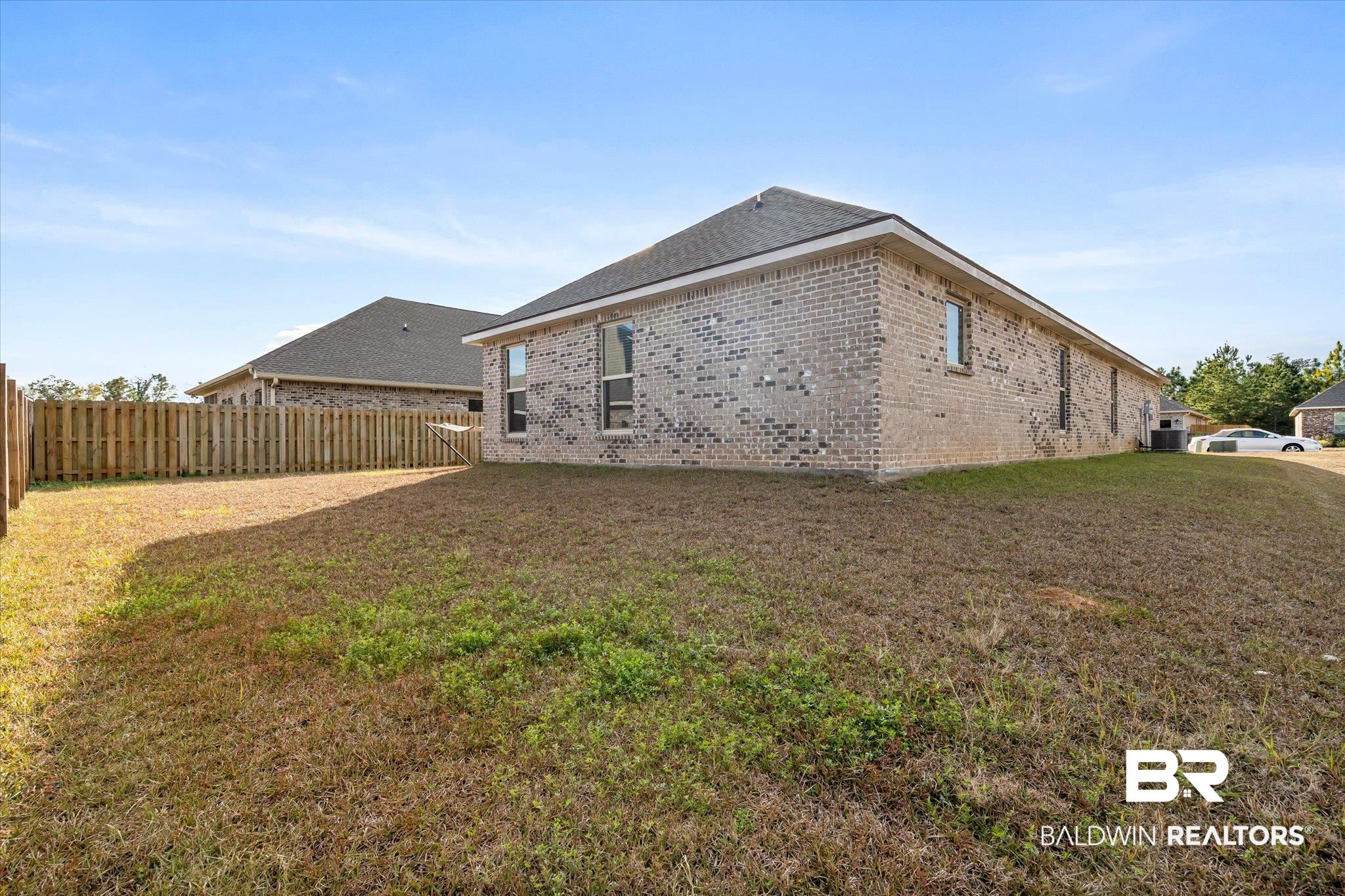 1116 Stella Road Foley, AL 36535 - Photo 26 of 29 Back of house featuring a lawn