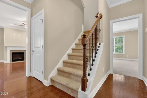a view of entryway and hall with wooden floor