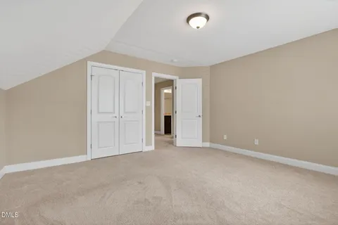 an empty room with an entryway door