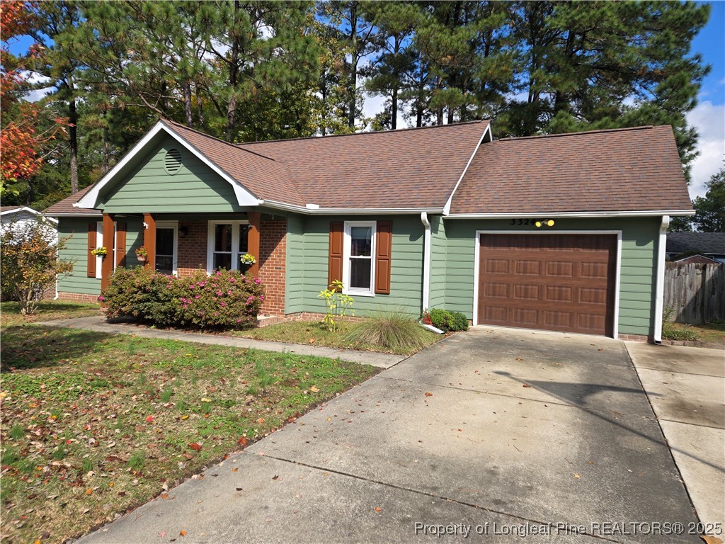 3324 Balero Court Spring Lake, NC 28390 - Photo 1 of 26 a house with trees in the background