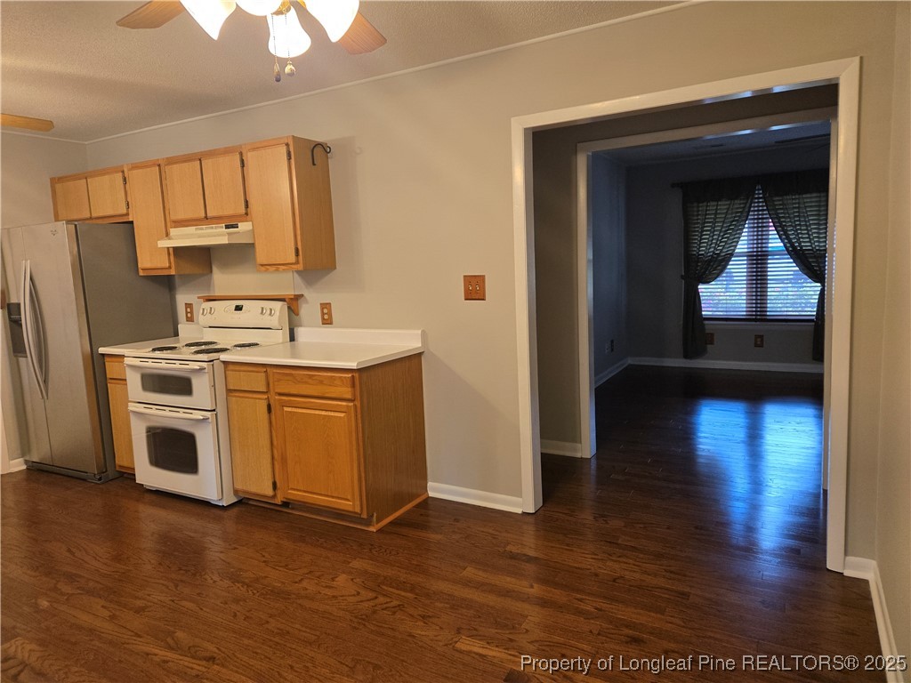 3324 Balero Court Spring Lake, NC 28390 - Photo 14 of 26 a kitchen with stainless steel appliances a stove a sink and a microwave