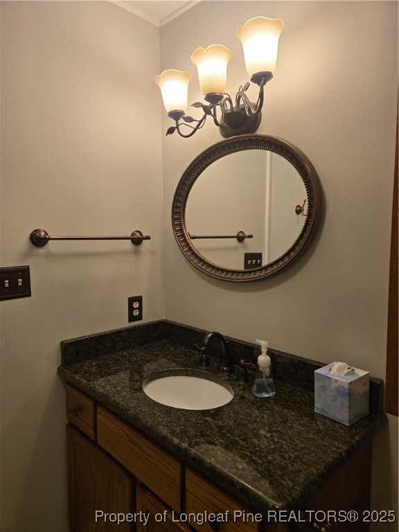 3324 Balero Court Spring Lake, NC 28390 - Photo 15 of 26 a bathroom with a granite countertop sink a mirror and vanity
