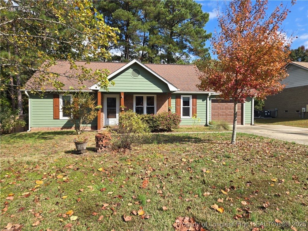 3324 Balero Court Spring Lake, NC 28390 - Photo 2 of 26 a house with trees in the background