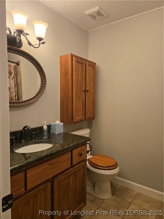 3324 Balero Court Spring Lake, NC 28390 - Photo 22 of 26 a bathroom with a granite countertop toilet and a sink
