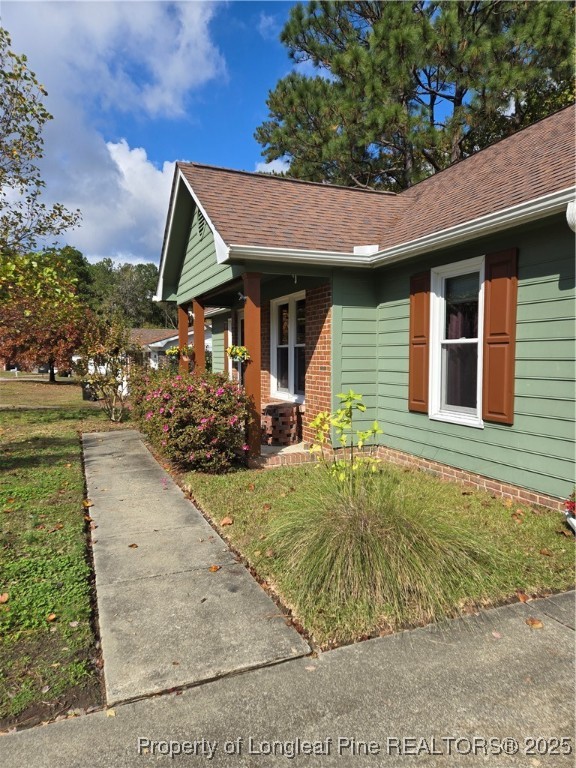 3324 Balero Court Spring Lake, NC 28390 - Photo 4 of 26 a backyard of a house with yard and outdoor seating