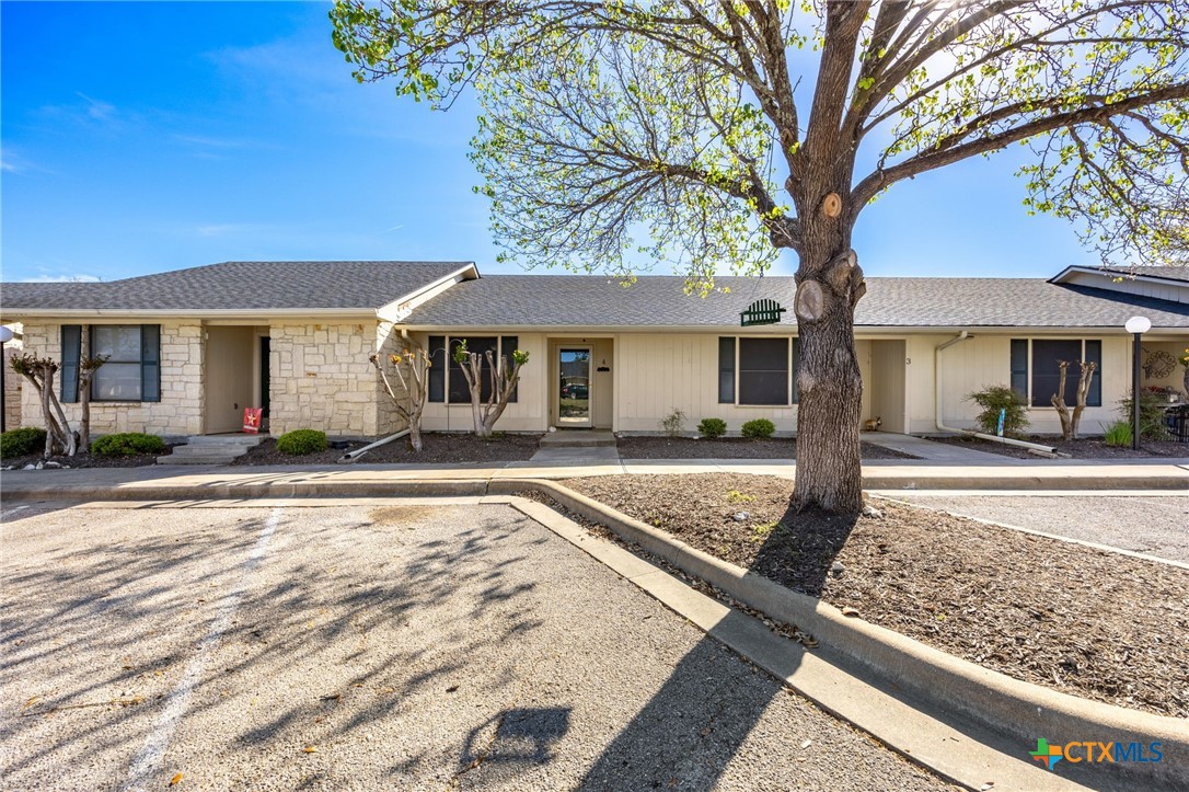 1015 Old Mill Road, Unit 4D Salado, TX 76571 - Photo 1 of 22 a front view of a house with garden