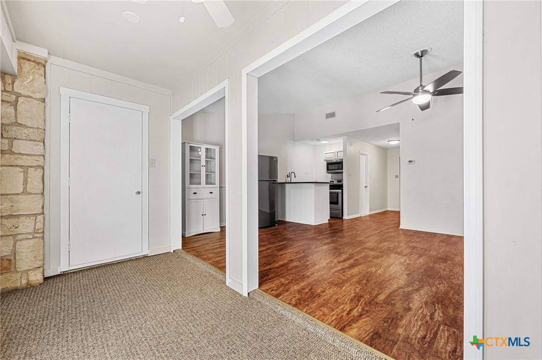 1015 Old Mill Road, Unit 4D Salado, TX 76571 - Photo 10 of 22 a view of empty room with wooden floor