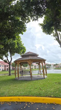 a view of yard with green space and porch