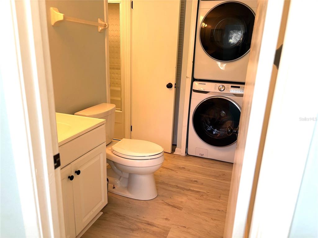 101 North Hill Avenue, Unit 7 Deland, FL 32724 - Photo 7 of 11 a view of a bathroom with a washer and dryer