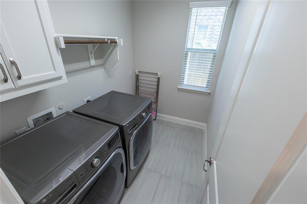 3920 Bentgrass Road Plano, TX 75023 - Photo 26 of 30 a utility room with dryer and washer