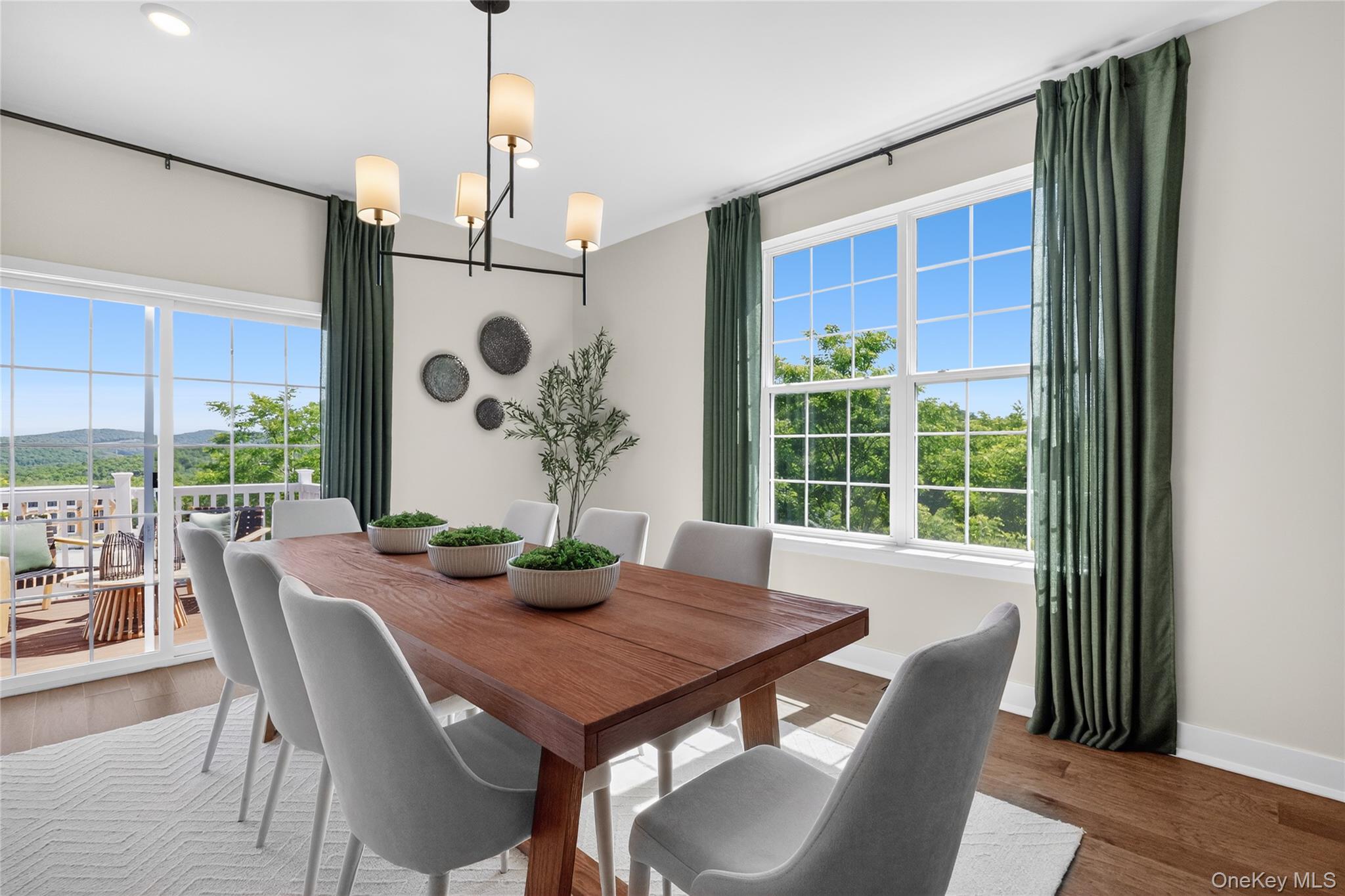 101 Pine Ridge Road Tuxedo Park, NY 10987 - Photo 4 of 26 Dining area featuring a modern linear chandelier and recessed lighting.