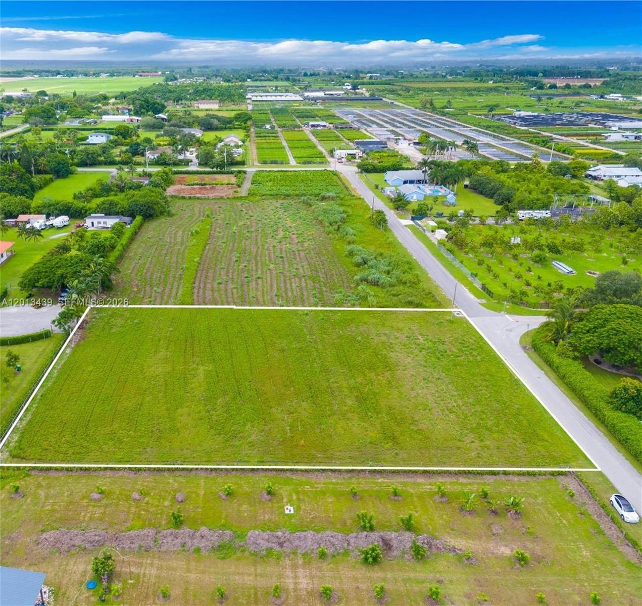 23400 Southwest 209th Place Homestead, FL 33031 - Photo 1 of 3 a view of an outdoor space and a lake view