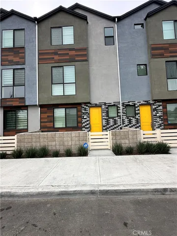 a view of a brick house with a large windows