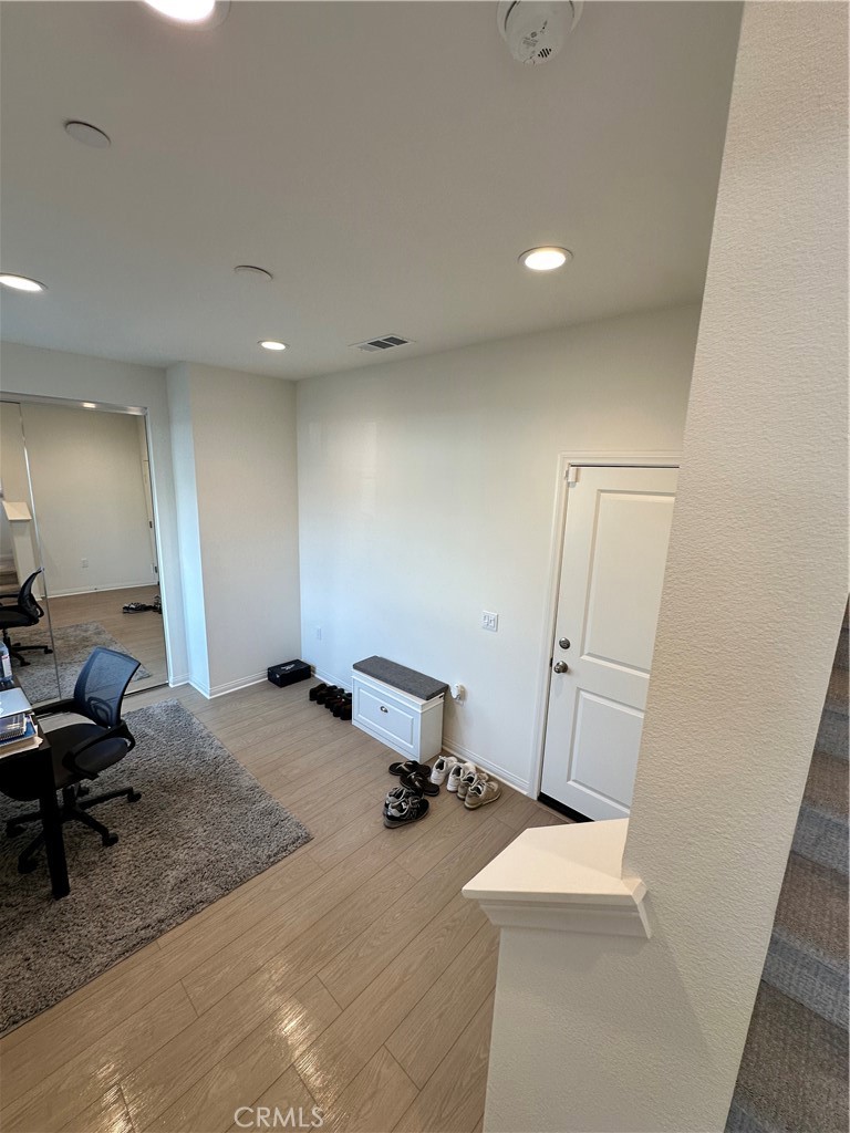 5864 Linden Avenue, Unit 3 Long Beach, CA 90805 - Photo 13 of 54 Entry level from the flex room with mirror closet to upper level.