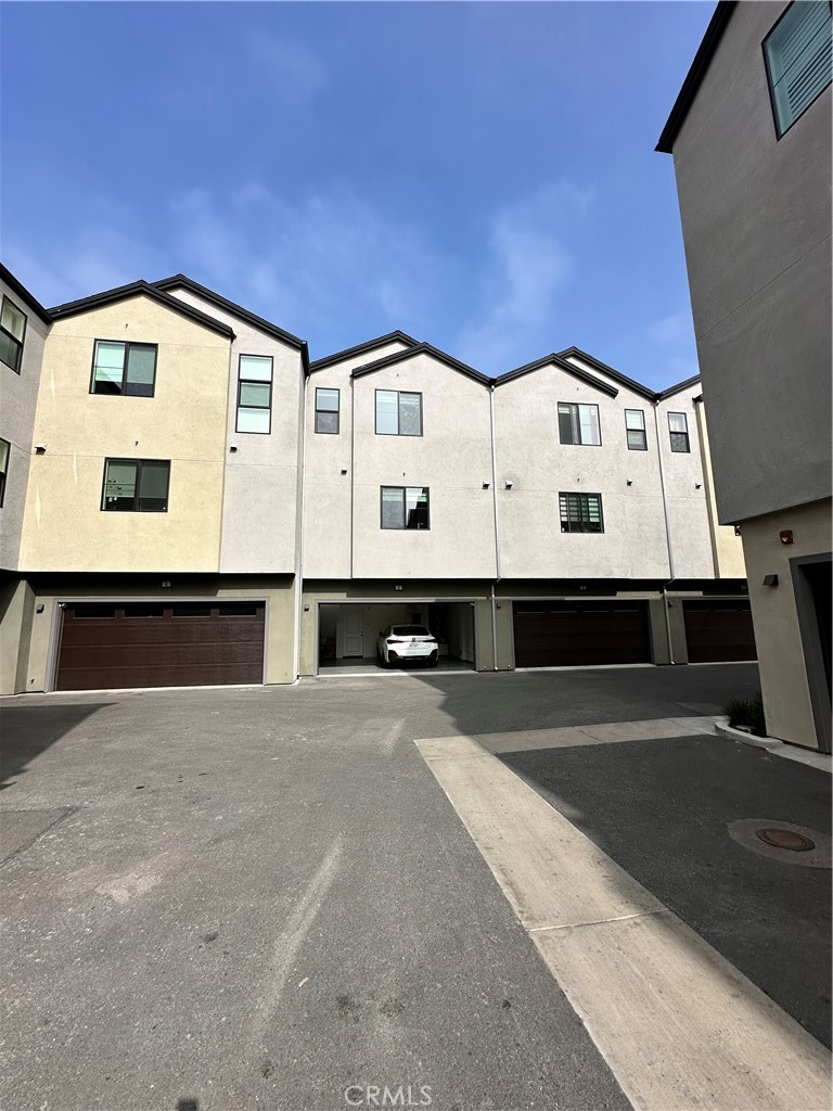 5864 Linden Avenue, Unit 3 Long Beach, CA 90805 - Photo 45 of 54 Back elevation, showing attached garage.