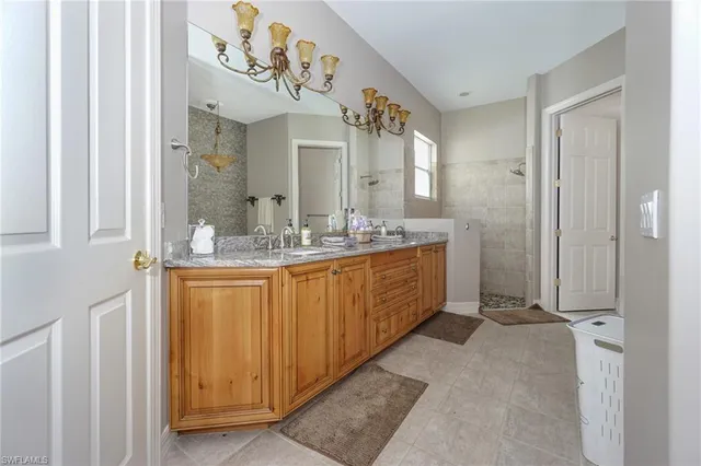 a bathroom with a double vanity sink mirror and double