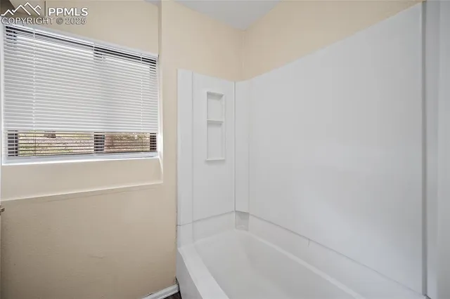 an empty room with windows