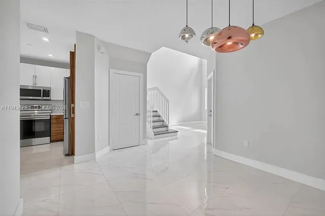 a view of a kitchen with a sink and dishwasher kitchen view