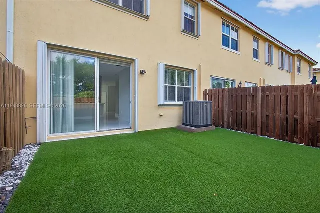 a view of backyard with a garden and entryway