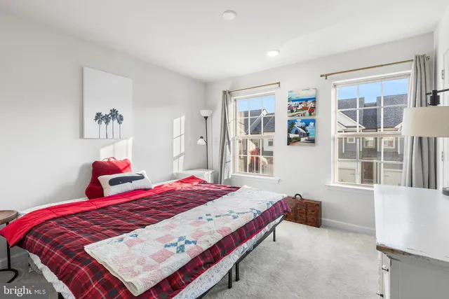 a bedroom with double bed and a window