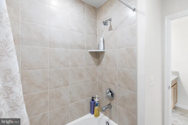 a bathroom with a sink and shower