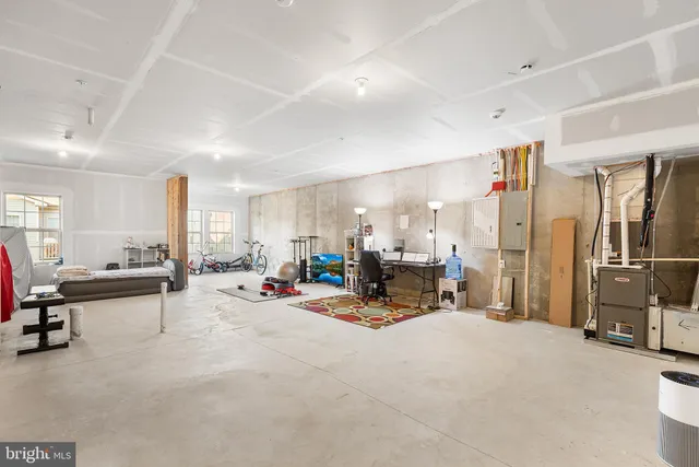 a view of a living room with furniture and a flat screen tv