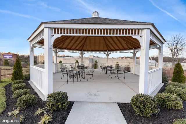 a view of a chairs and table in the patio