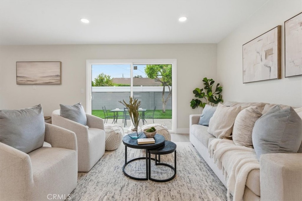 168 226th Street Carson, CA 90745 - Photo 12 of 40 a living room with furniture a large window and a table