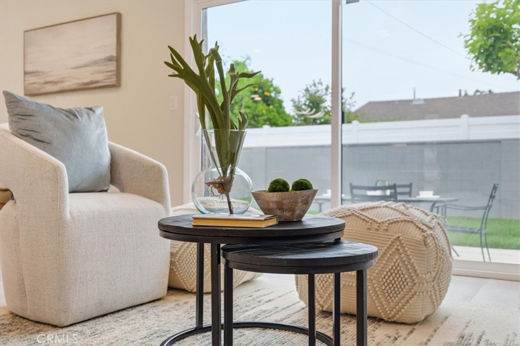 168 226th Street Carson, CA 90745 - Photo 13 of 40 a living room with a table and a potted plant