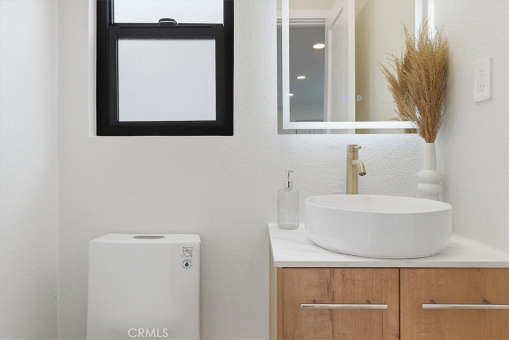 168 226th Street Carson, CA 90745 - Photo 17 of 40 a bathroom with a sink and a mirror