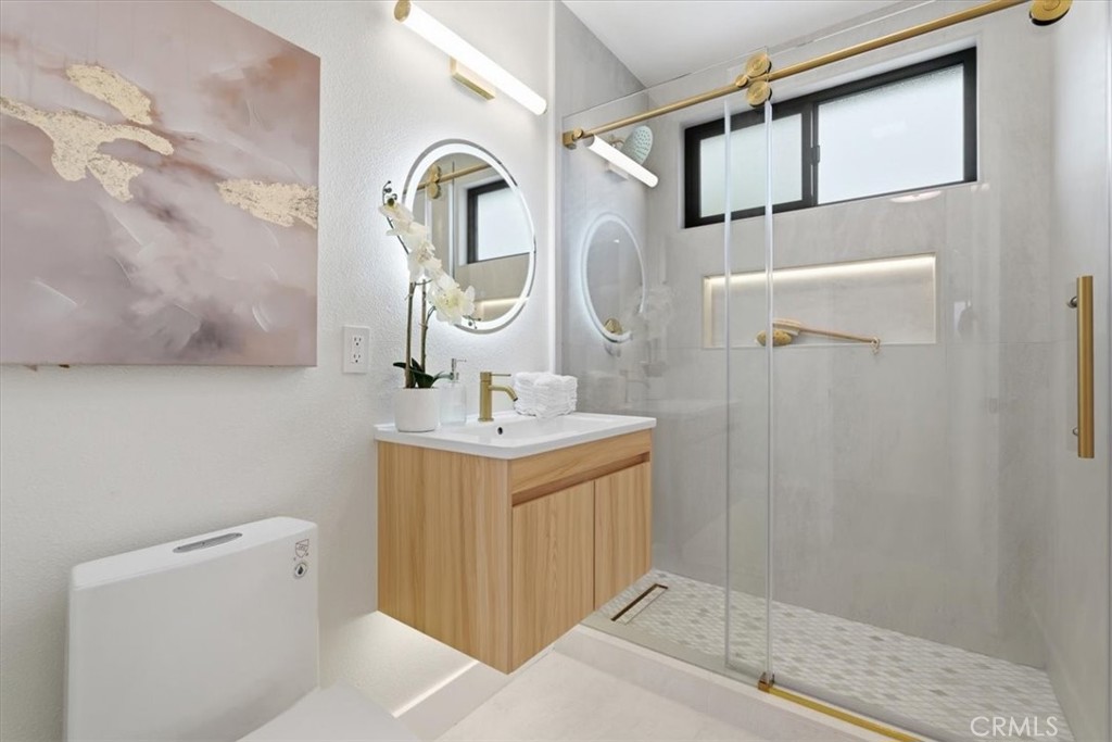 168 226th Street Carson, CA 90745 - Photo 20 of 40 a bathroom with a sink a toilet and shower